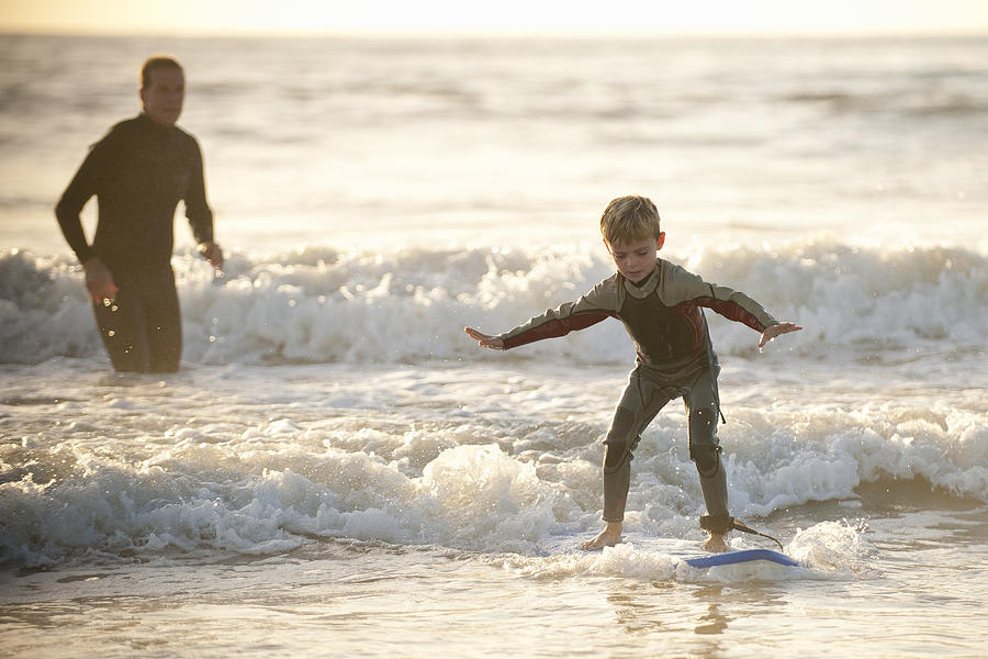 Father Teaching Small Son To Surf Photograph by Stephen Simpson