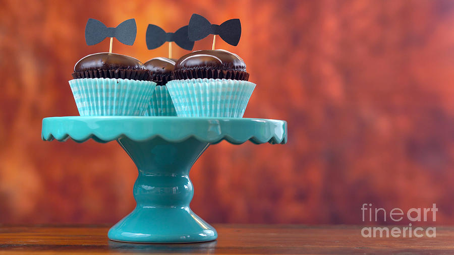 Fathers Day close up of cupcakes against rustic wood background with copyspace. Photograph by Milleflore Images