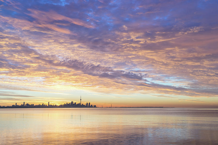 Feathers Ripples and Glow - Glorious Multicolored Dawn over Toronto Skyline Photograph by Georgia Mizuleva