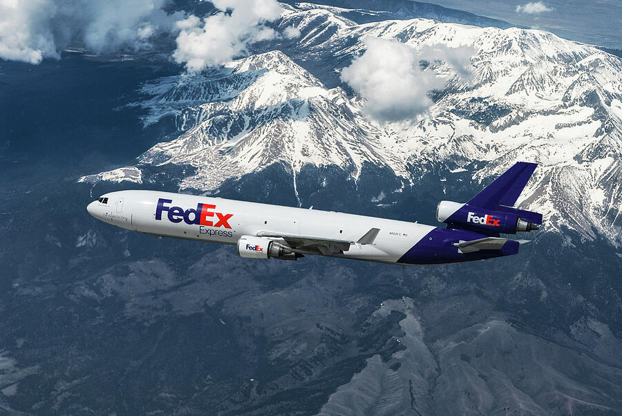 FedEx Over Snowcapped Mountains Mixed Media by Erik Simonsen