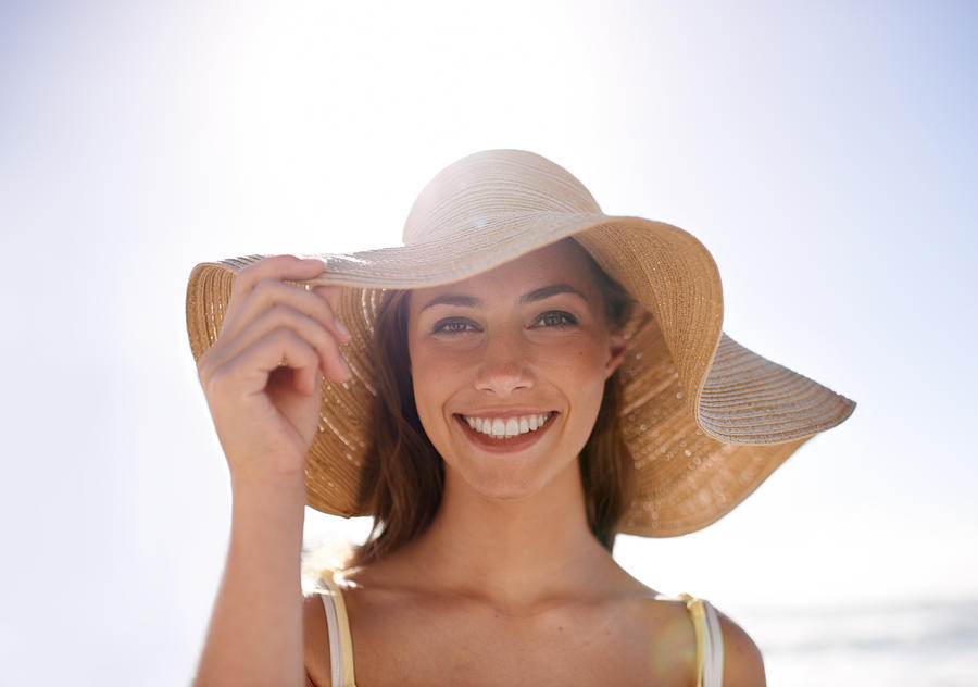Feeling summery in her sunhat Photograph by PeopleImages
