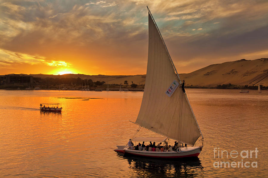 Feluccas at sunset on the river Nile, Egypt Photograph by Neale And Judith Clark