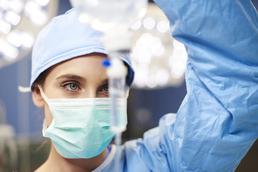 Female anesthesiologist during hard operation Photograph by Gpointstudio