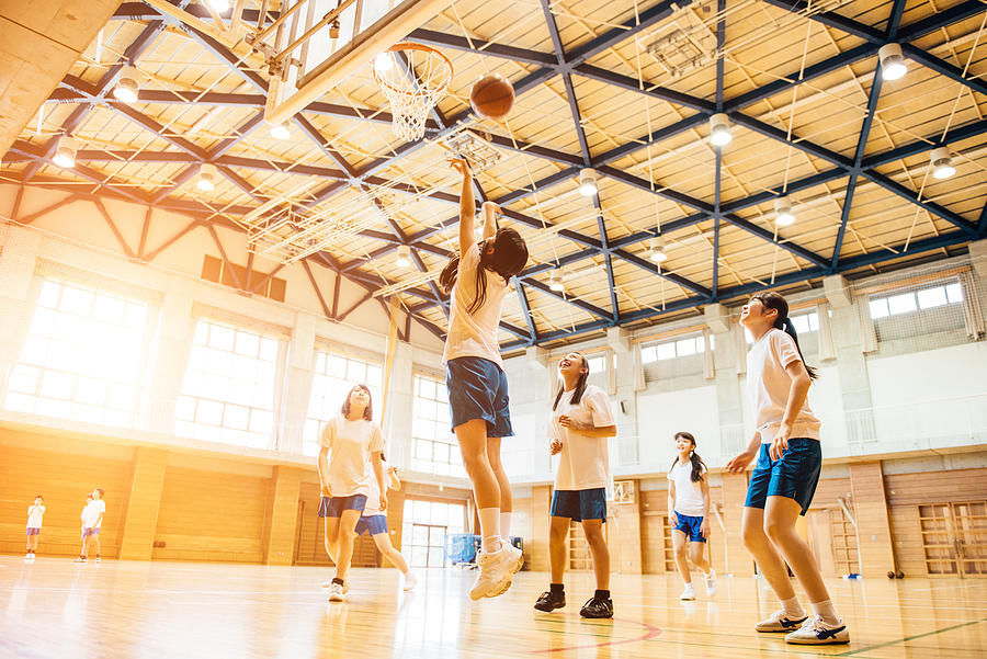 Female Basketball Team Playing in Japanese High School Photograph by Ferrantraite