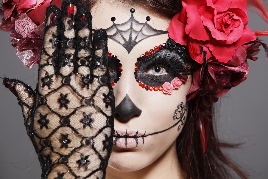 Female brunette in scary makeup acknowledges Day of the Dead Photograph by Kparis