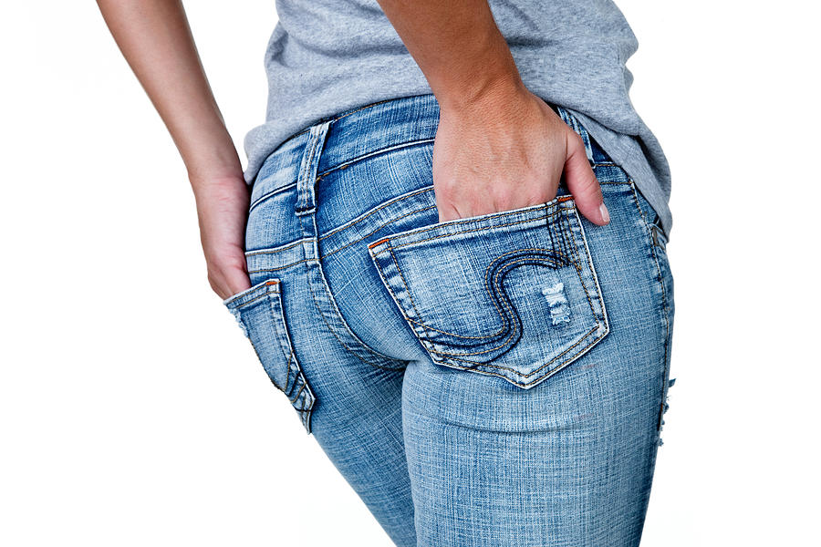 Female buttocks wearing jeans Photograph by John Sommer