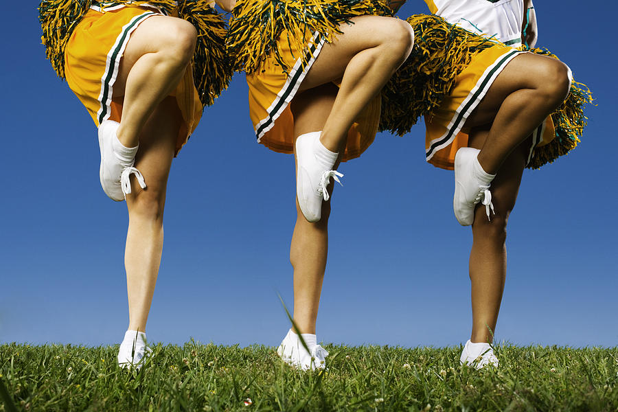 Female cheerleaders legs (low section) Photograph by Victoria Snowber