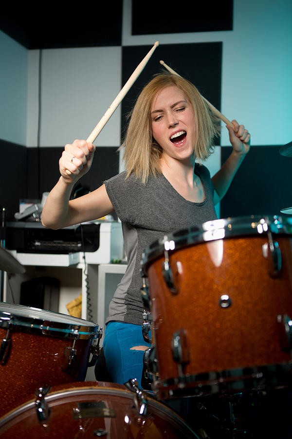 Female drummer performing Photograph by Severin Schweiger