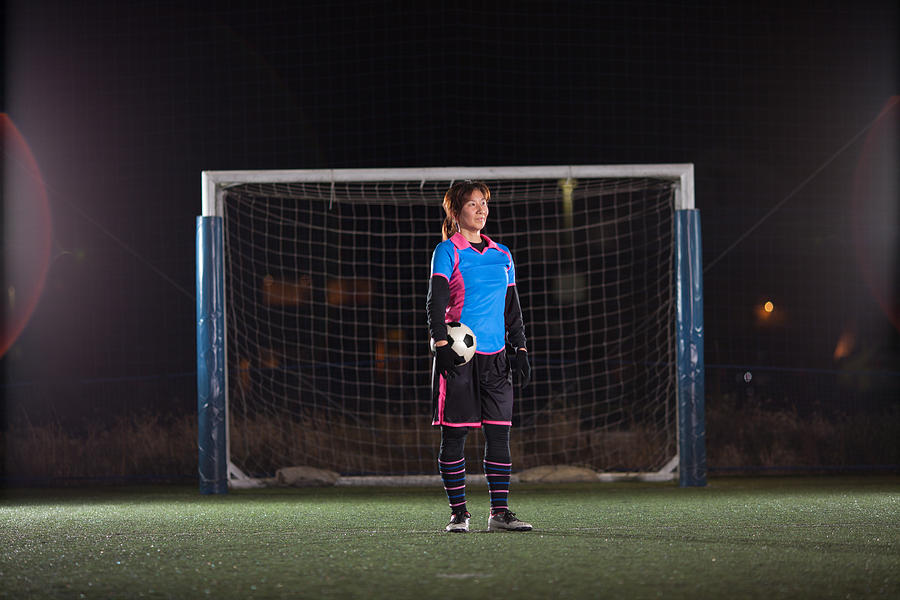 Female Goalkeeper With Ball In Front Of The Goal Photograph by Trevor Williams