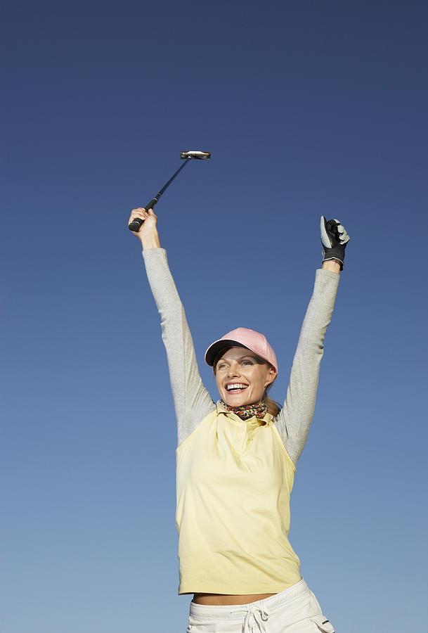 Female Golf Player With Her Arms Up Photograph by John Cumming