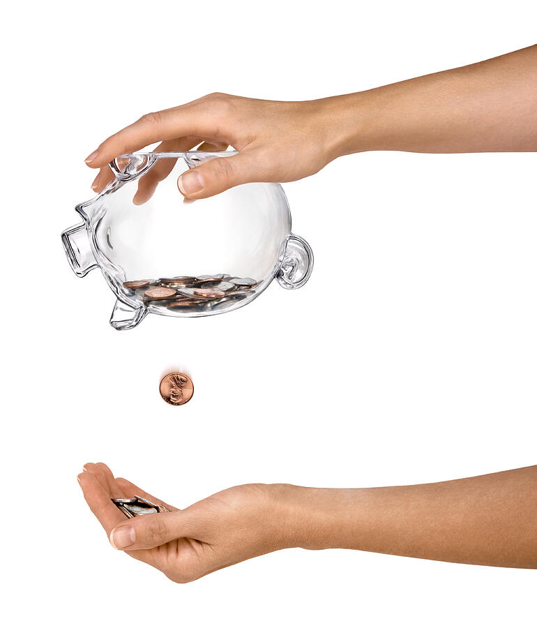 Female Hands Holding Clear Piggy Bank Shaking Out Coins Isolated Photograph by Ryasick