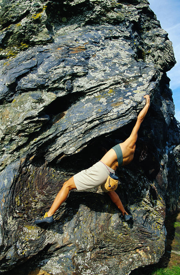 Female rock climber bouldering outdoors Photograph by David Madison