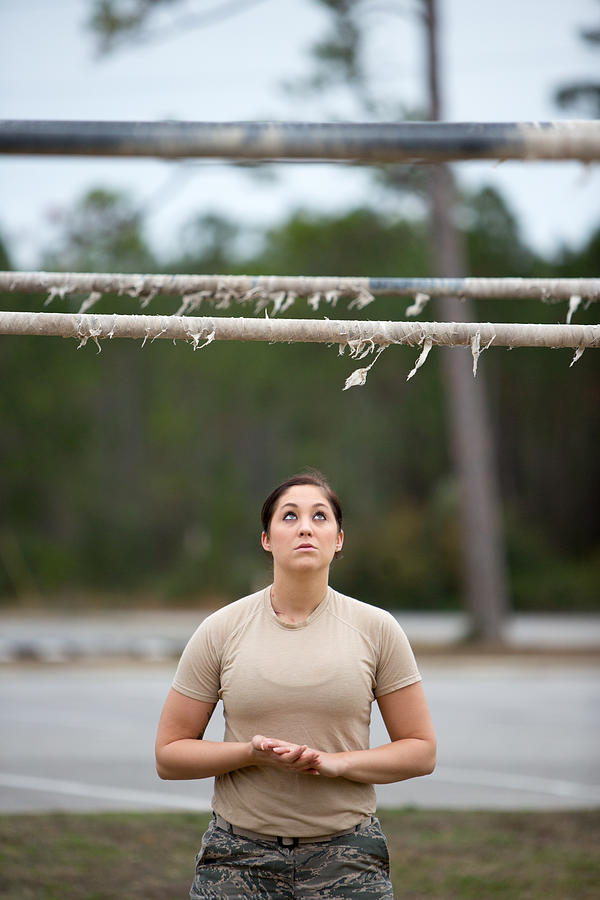 Female Soldier Looking Up at Pull Up Bar Photograph by Sean Murphy