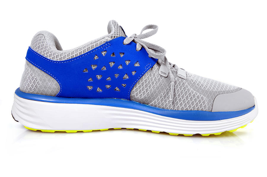 Female sports shoe with blue accents Photograph by Kevinjeon00
