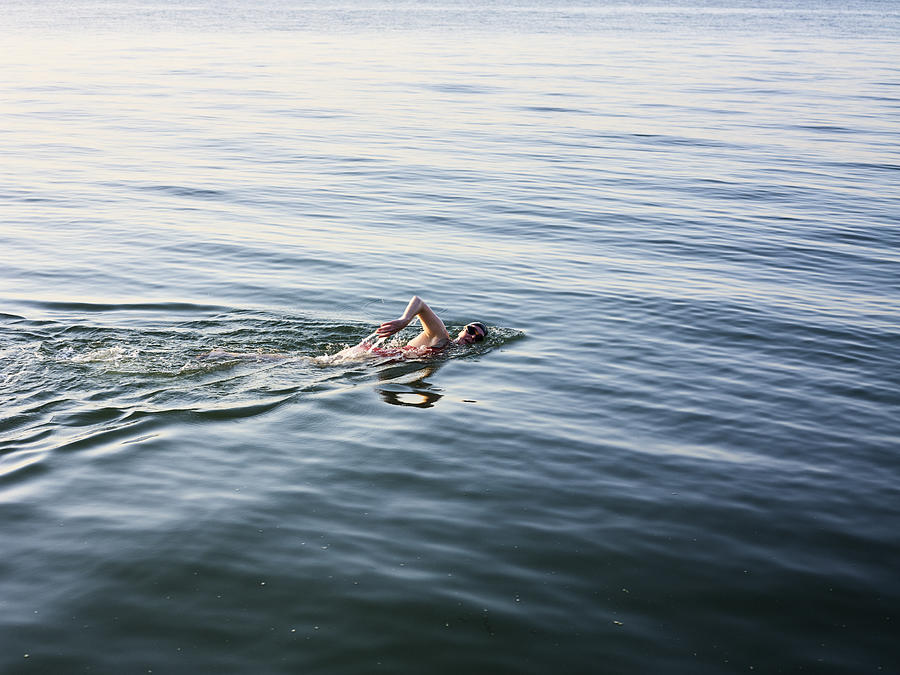 Female swimmer in the sea Photograph by Gary Yeowell