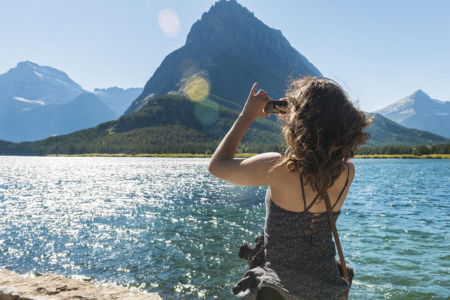 Feminine Woman Explores Scenic Glacier National Park with Camera Montana Photograph by Boogich