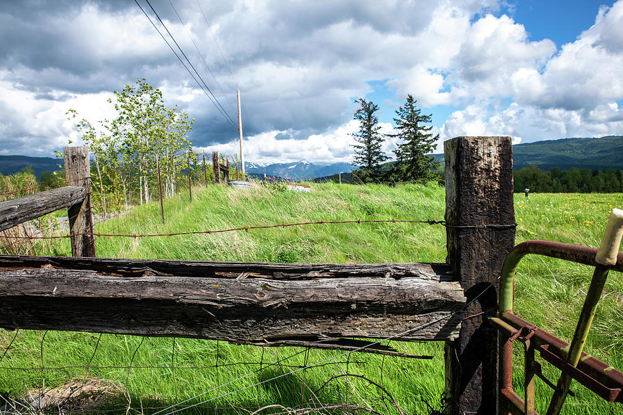 Fence Post and Clouds Photograph by Tom Cochran