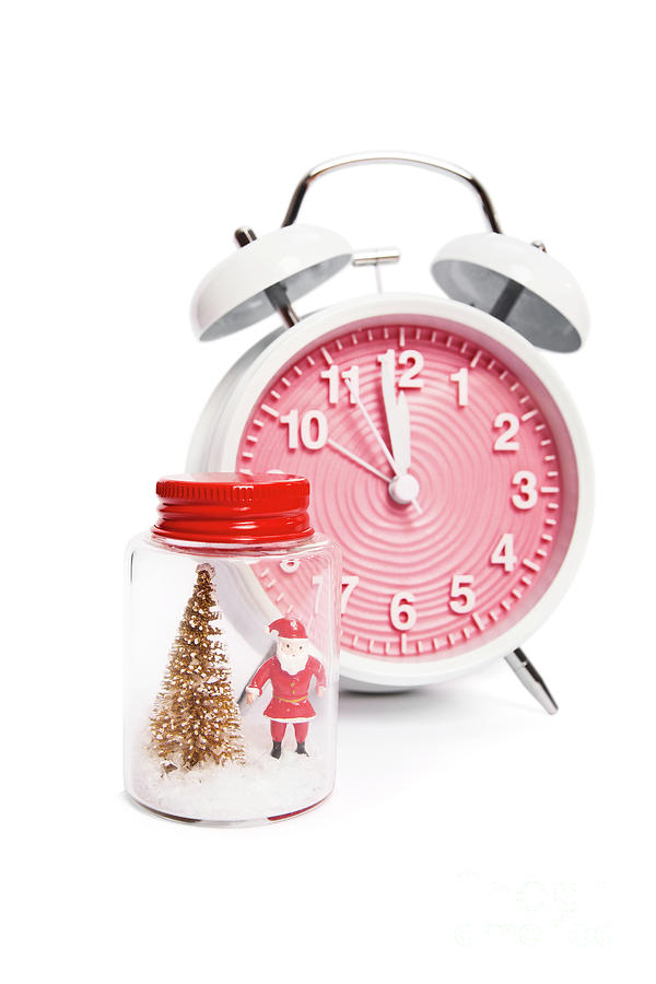 Festive alarm clock and a Christmas ornament with Santa Claus Photograph by Mendelex Photography