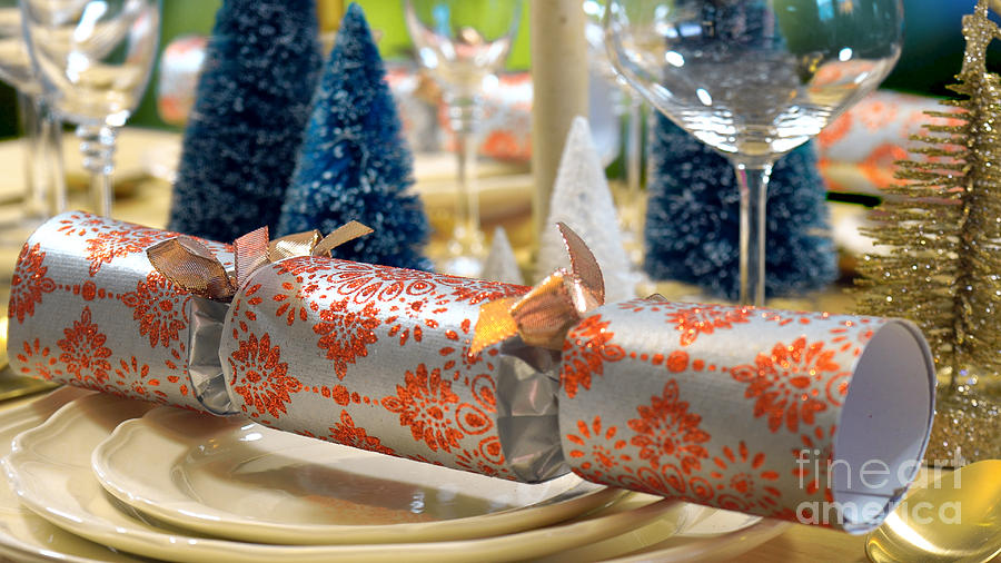 Festive Christmas lunch table close up on cracker bon bon. Photograph by Milleflore Images
