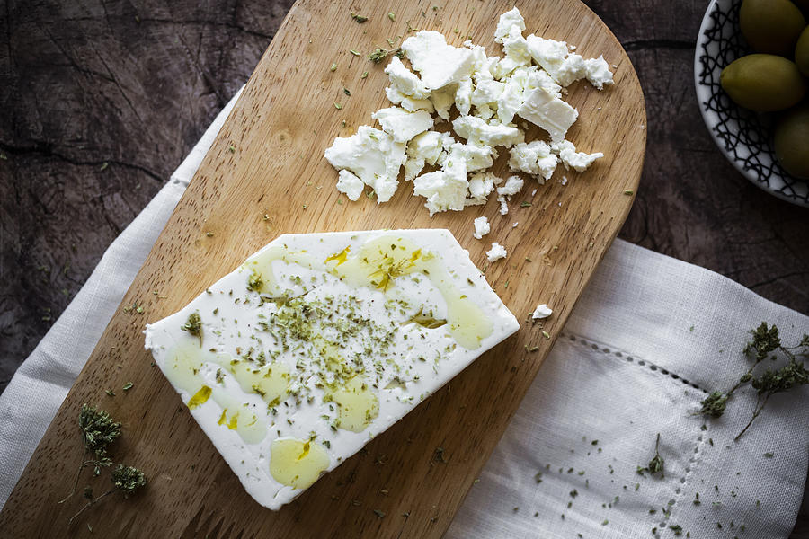 Feta cheese on cutting board Photograph by Westend61
