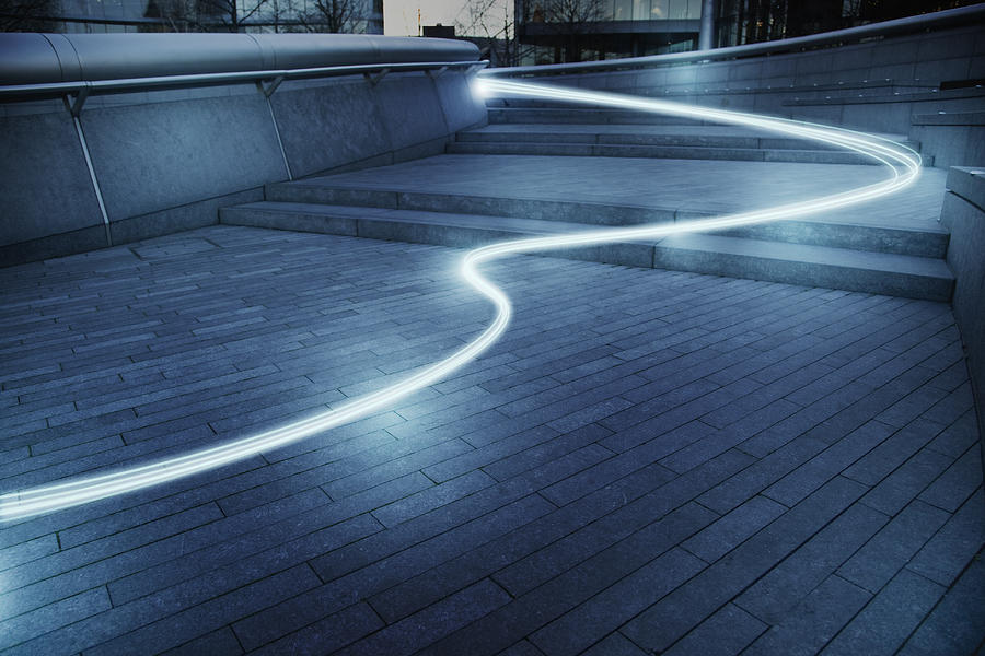 Fiber optic light trail communication technology streaming, concept Photograph by Caia Image
