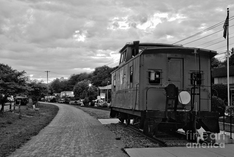 Fiery Skies Over The Export PA Caboose Black And White Photograph by Adam Jewell