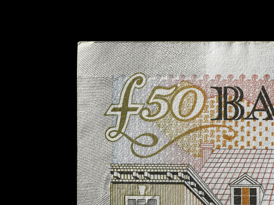 Fifty pound note against black background, close-up Photograph by Jeffrey Coolidge
