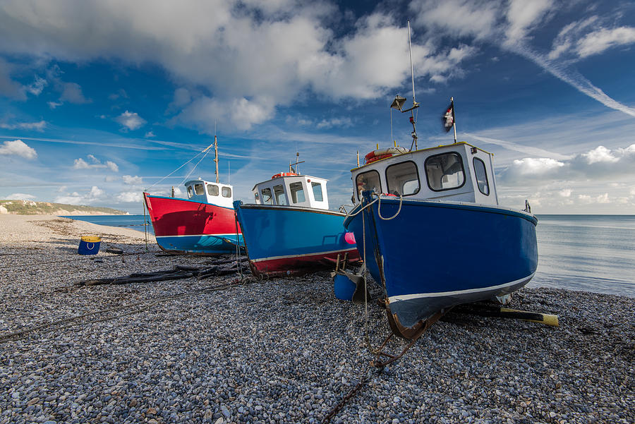 Fiherman boats on pebles at beach in Beer, Devon,UK Photograph by Merc67