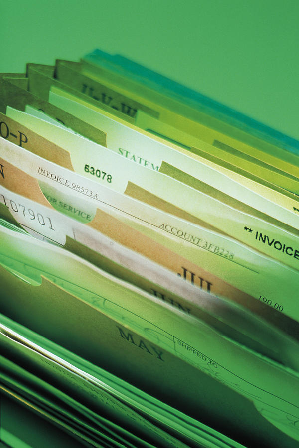 Files in accordion file Photograph by Comstock
