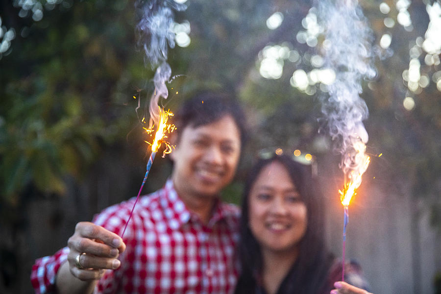 Filipino Couple Holding Sparklers Photograph by Adamkaz