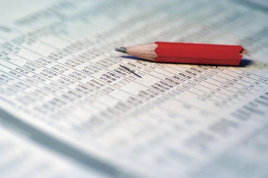 Financial document red pencil on it, extreme close-up Photograph by Medioimages/Photodisc