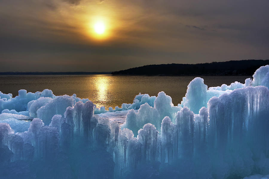 Fire and Ice - Ice castle under construction along shore of Lake Geneva WI Photograph by Peter Herman