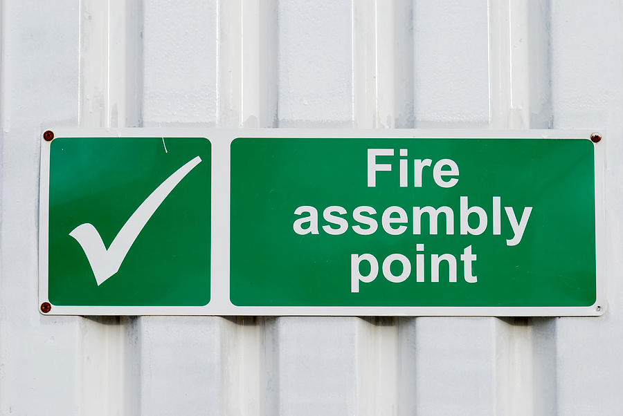 Fire assembly point green sign Photograph by Ilbusca