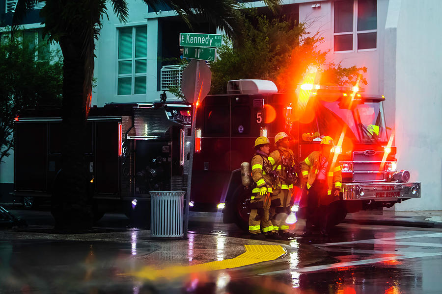 Firefighters in the Rain Photograph by Robert Wilder Jr