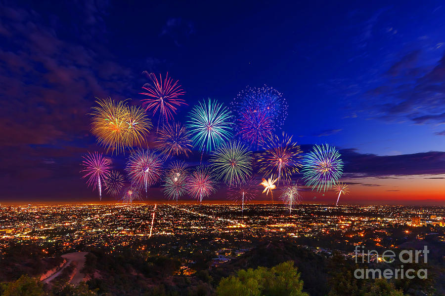 Fireworks over Los Angeles skyline at blue hour cityscape photo