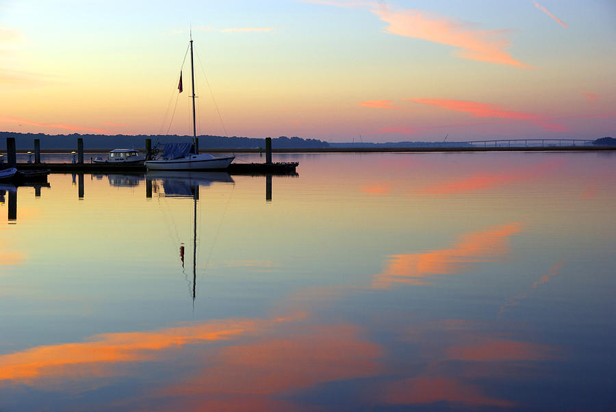Sailboat at First Light - Mirror like still harbor waters in Beaufort, South Carolina Photograph by Kenneth Lane Smith