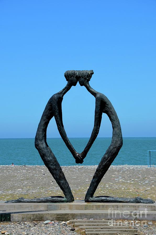 First Love sculpture art with Black Sea beach backdrop Batumi Georgia Photograph by Imran Ahmed