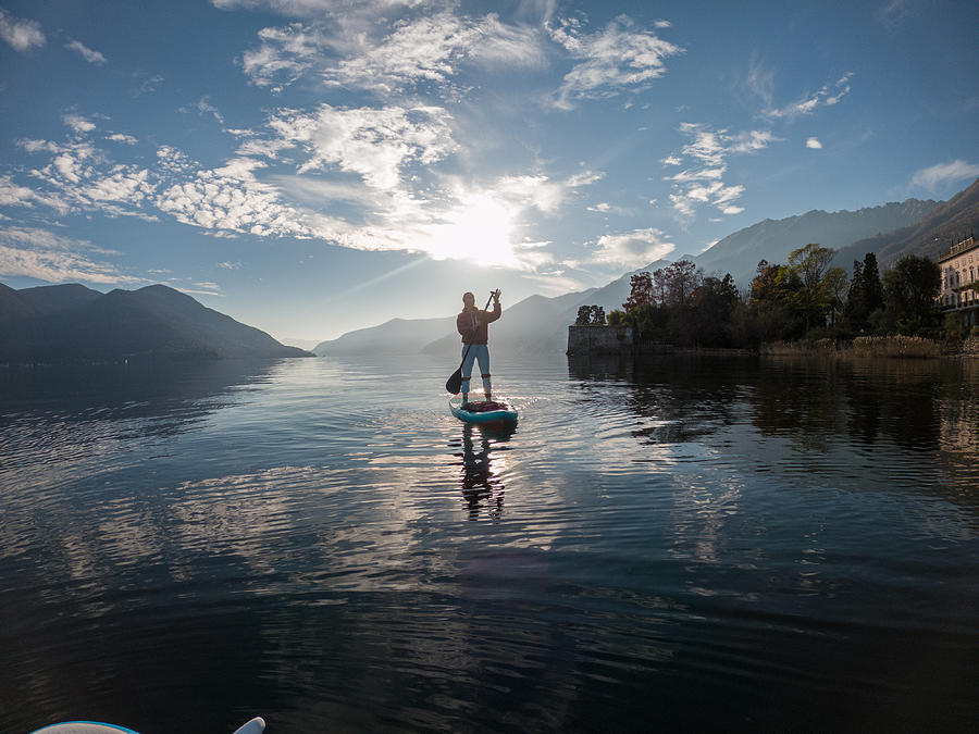 First person point of view of a woman paddling on a stand up paddle board Photograph by Swissmediavision