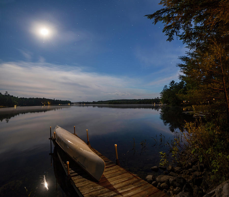First Quarter Moon and Canoe Photograph by John Meader