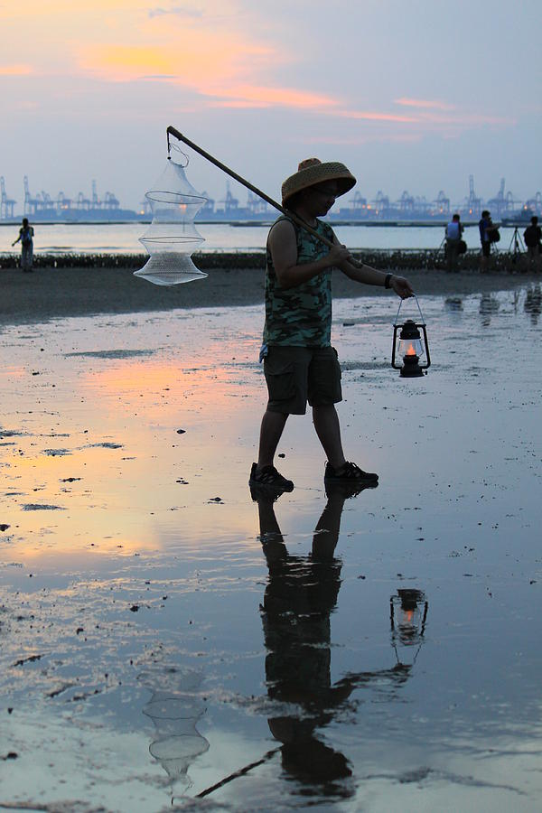 Fisherman And His Inverted Image At Sunset Photograph