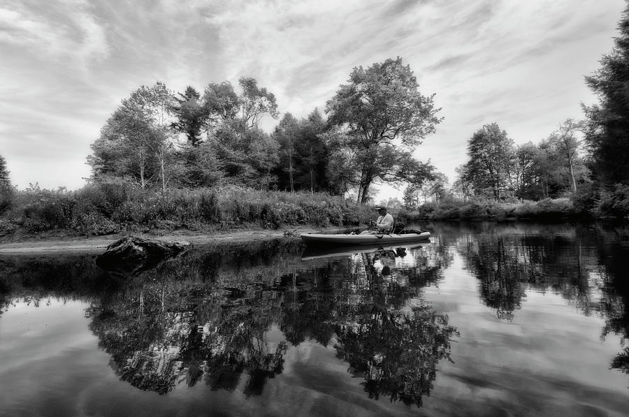 Fisherman fishing on calm river Photograph by Dan Friend