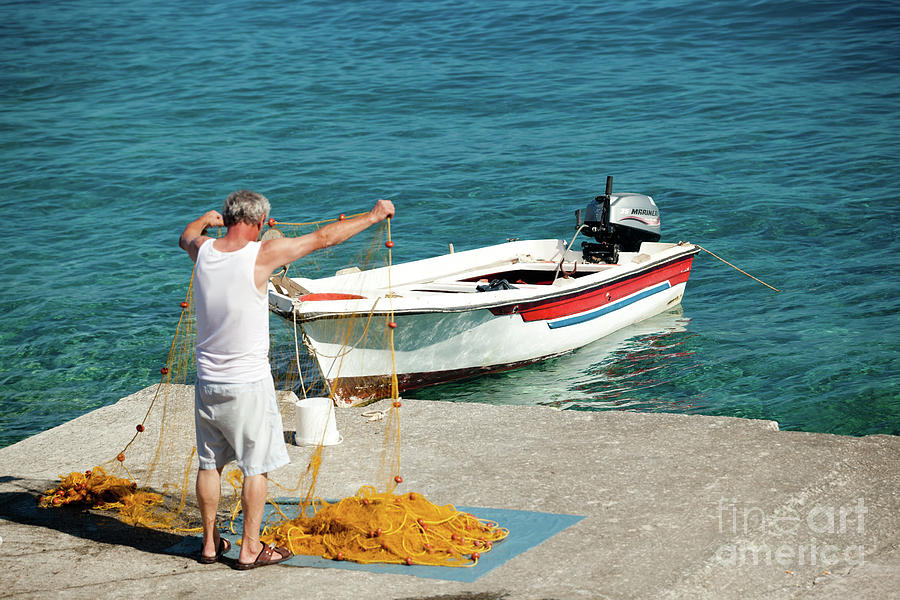 Fisherman in Agia Roumeli II Photograph by Rich S