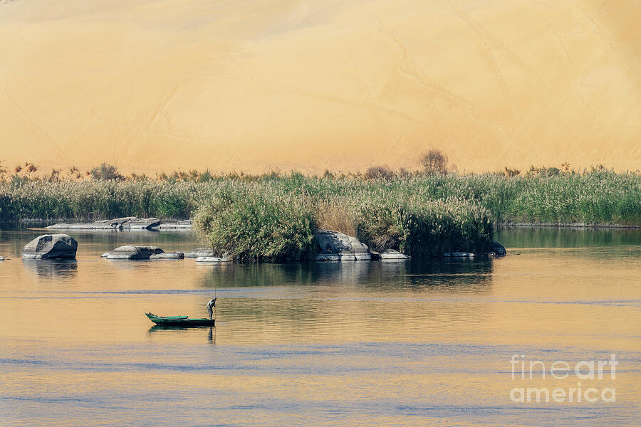 Fisherman on the Nile river in Aswan, Egypt Photograph by Delphimages Photo Creations