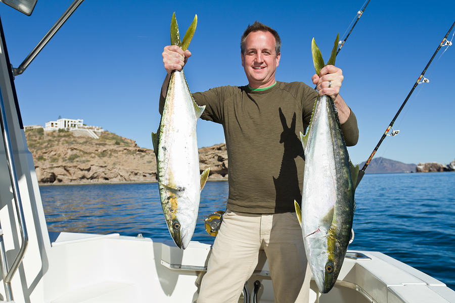 Fisherman with Tuna or Yellow Tail Mackeral Fish Photograph by Grandriver