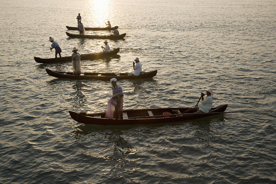 Fishermen at dawn in Cochin, India Photograph by John Lund