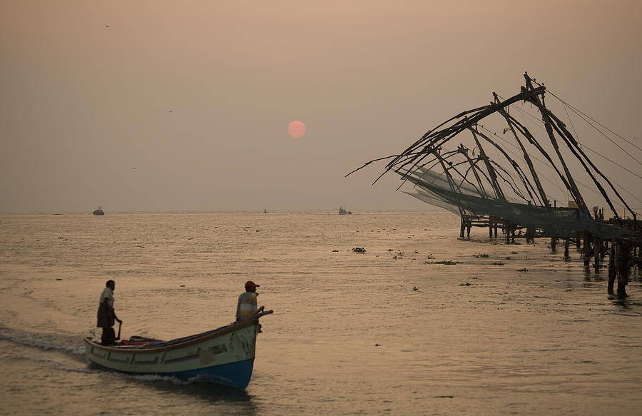 Fishermen at dawn with Chinese fishing nets Photograph by John Lund