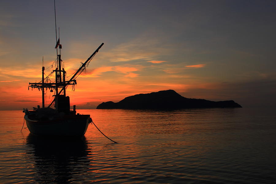 Fishing boat and sunrise Photograph by 25092526