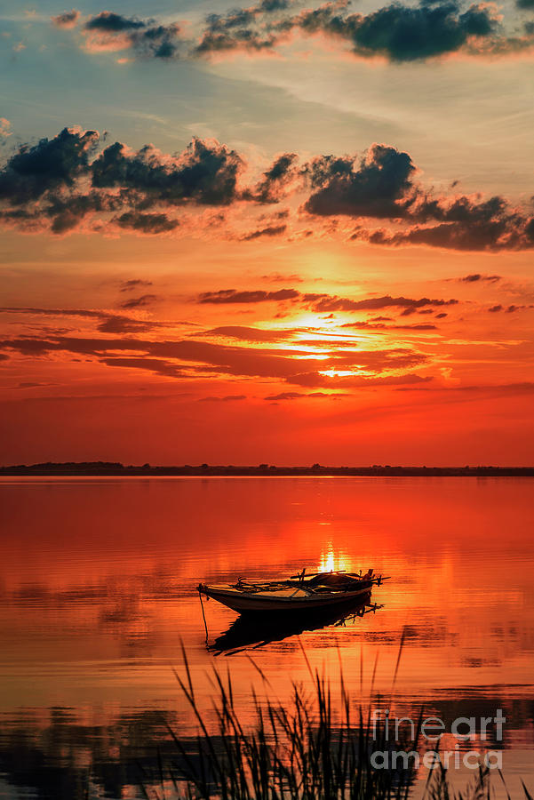 Fishing boat at sunset Photograph by Jelena Jovanovic