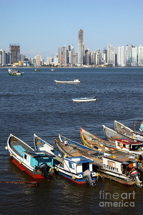 Fishing boats and Paitilla skyscrapers Panama City Photograph by James Brunker