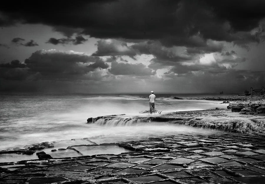 Fishing in bad weather - Monochrome long exposure photo Photograph by Stephan Grixti